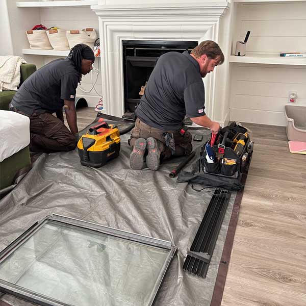 Technicians Servicing Gas Fireplace