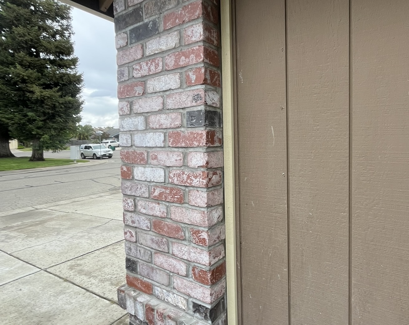A home's masonry wall rebuilt by Elite Fireplace.