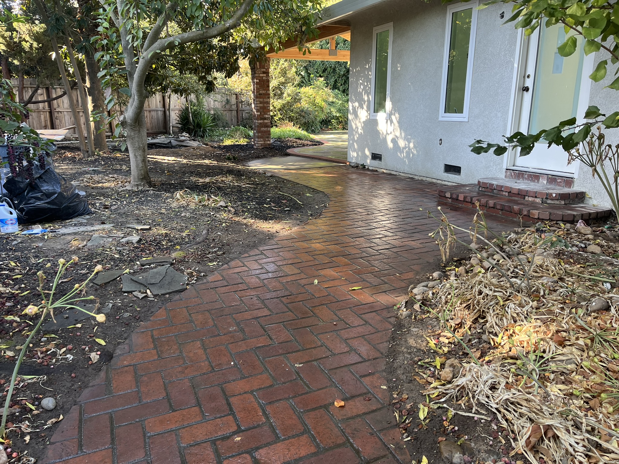 A brick walkway built by Elite Fireplace.